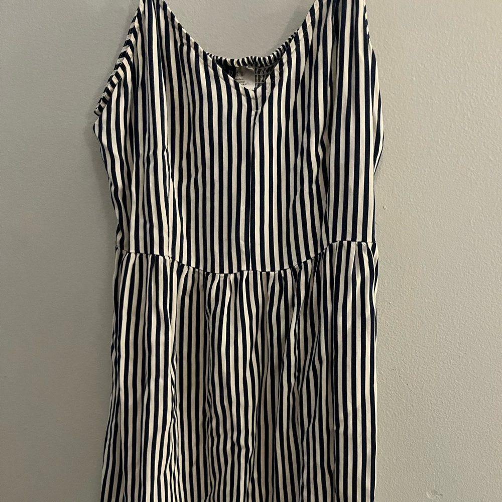 Dark navy blue and white stripped strap dress. Runs Medium but is stretchy